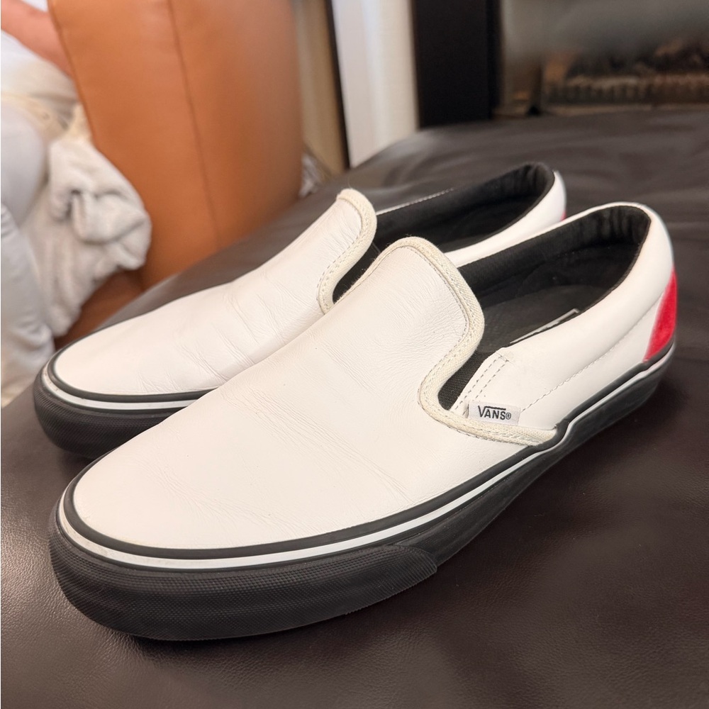 Vans White Leather Slip-On Sneakers with Black Sole and Red Heel